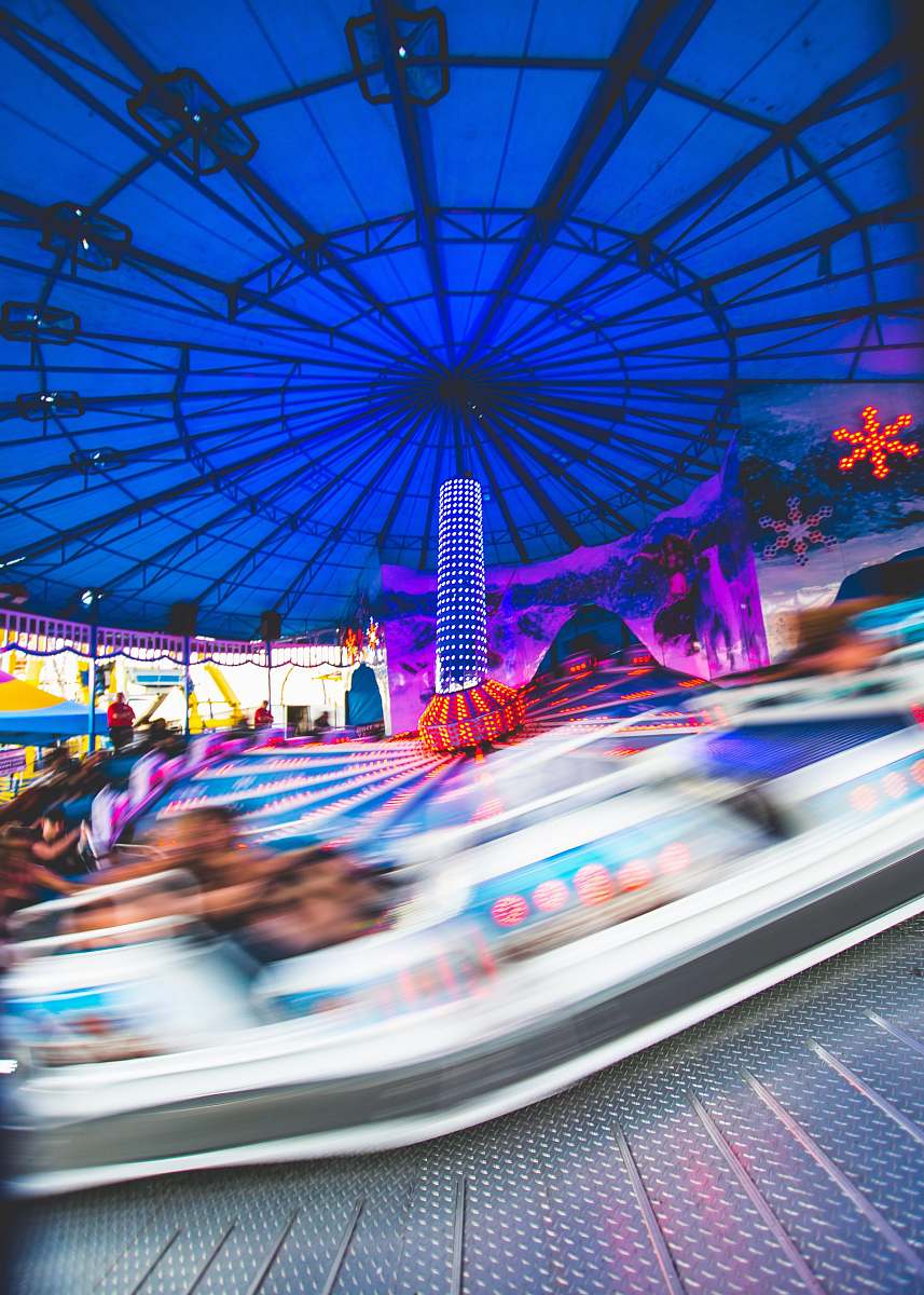 carnival people riding carousel during daytime fairground